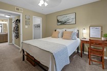 Spacious Bedroom with Carpet and Walk-In Closet at Raiders Walk